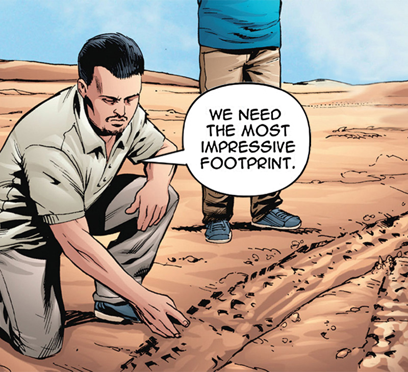 Man studies tire tracks in sandy dirt.