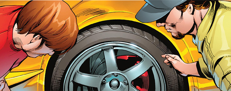 Inspectors examine red performance car tire.